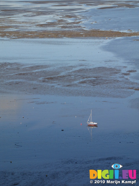 SX11928 Beached sailboat on Swansea Bay mud sands